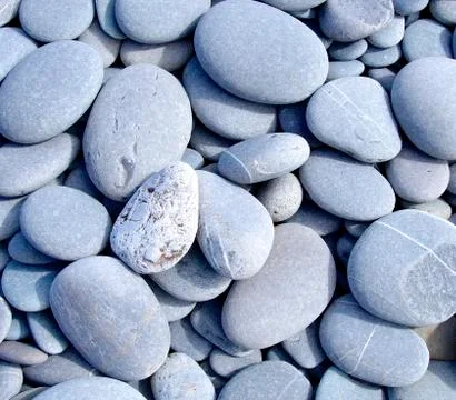 The hard pebbles closeup on the beach Stock Photos