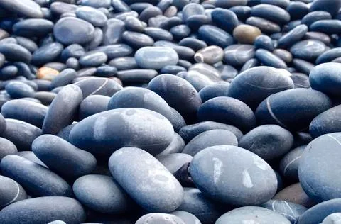 The hard pebbles closeup on the beach Stock Photos