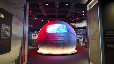 The Hard Problems of Peace exhibit sphere shifts colors in a museum Stock Footage 333920826