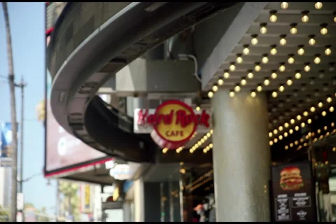 Hard Rock Cafe Sign Rack Focus on Hollywood Boulevard Stock Footage 340531518
