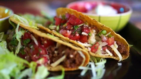 Hard shells beef taco with salsa sauce. Popular Mexican food Vídeos de archivo 69251550