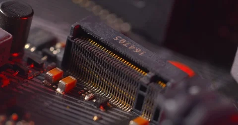 The hard ssd drive plugs into the socket of Sata m.2 close up Stock Footage 125916995