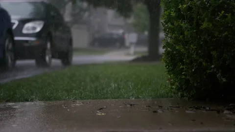 Hard storm, with loud thunder and lightning, a suburban residential street Stock Footage 217991442