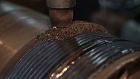 Hard surfacing by submerge arc welding process. Cnc machine builds up the metal Stock Footage 75249069
