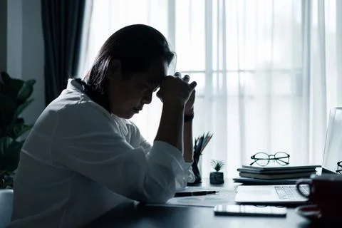 Hard think on analysis in the work. Young asian business woman is working o.. Stock Photos