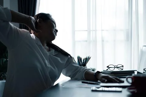 Hard think on analysis in the work. Young asian business woman is working o.. Stock Photos