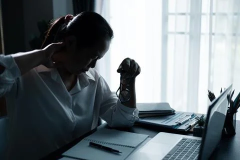 Hard think on analysis in the work. Young asian business woman is working o.. Stock Photos