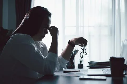 Hard think on analysis in the work. Young asian business woman is working o.. Stock Photos