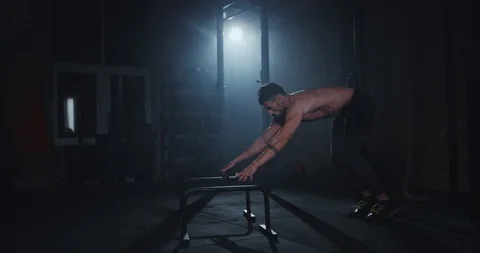 Hard training workout for a body guy in a cross fitness class complex of Stock Footage 118605098