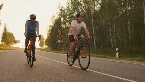 Hard Training.Triathlete two Cyclist Training On Road Bicycle. two Cyclist Video stock 114819560