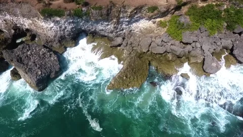 Hard waves on the cliffs of the coast of Bali, Indonesia Stock Footage 213922836
