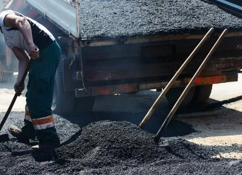 Hard work on asphalt construction Foto stock