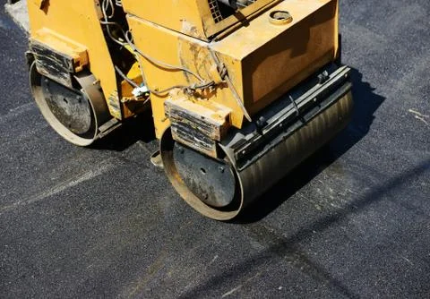 Hard work on asphalt construction Stock Photos