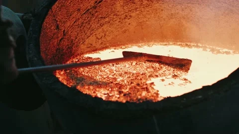 Hard work in a foundry. Metal smelting furnace in steel mill. Molten metal Stock Footage 155377992