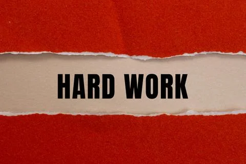 Hard Work message written on ripped torn paper background. Conceptual Hard .. Stock Photos