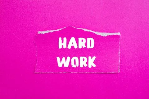 Hard Work message written on ripped torn paper background. Conceptual Hard .. Stock Photos