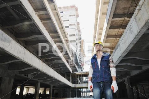 Hard worker on construction site Stock Photos