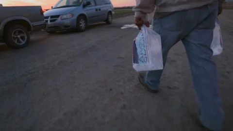 Hard Working Immigrant Man prepares for Heat with Blocks of Ice Stock Footage 101973105