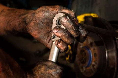 Hard working man with hands full of oil Stock Photos