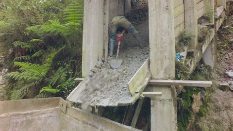 Hard Working Man Shoves Material From A Ramp Stock Footage 94736535