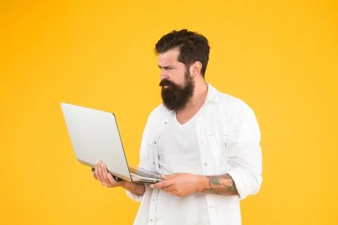 Hard working. Programmer with computer. brutal man surfing internet. hipster use Foto stock