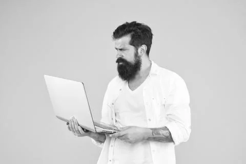 Hard working. Programmer with computer. brutal man surfing internet. hipster use Stock-Fotos