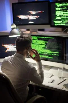 Hard-Working Programmer with Smartphone Stock Photos