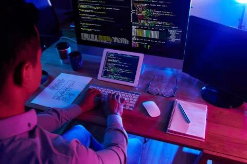 Hard-Working Programmer Writing Code 写真素材