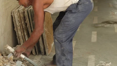 Hard working Worker, removing tiles, keeping tiles aside for recycle use. Stock Footage 245096431
