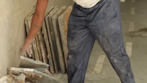 Hard working Worker, removing tiles, keeping tiles aside for recycle use. Stock Footage 245096455