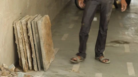 Hard working Worker, removing tiles, keeping tiles aside for recycle use. Stock Footage 245096554