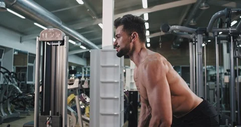 Hard workout day at gym class closeup perfect looking guy lifting the weights Stock Footage 116037109