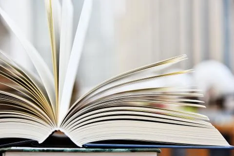 Hardcover book lying on the table in the library Foto stock