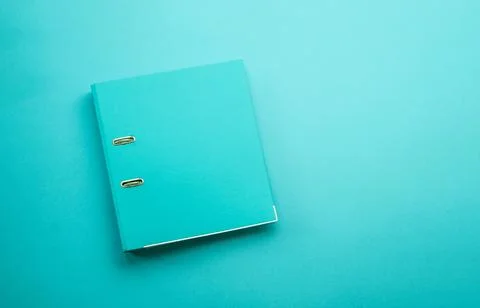 Hardcover folder on blue background Foto stock