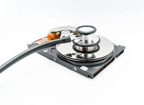 Harddisk and stethoscope Stock Photos