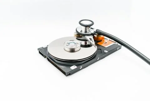 Harddisk and stethoscope Stock Photos