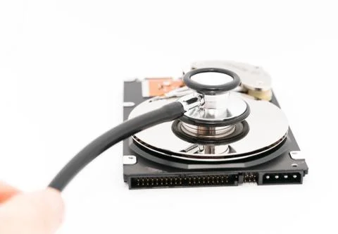 Harddisk and stethoscope Stock Photos