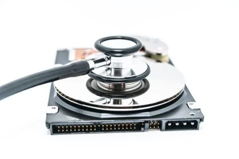 Harddisk and stethoscope Stock Photos