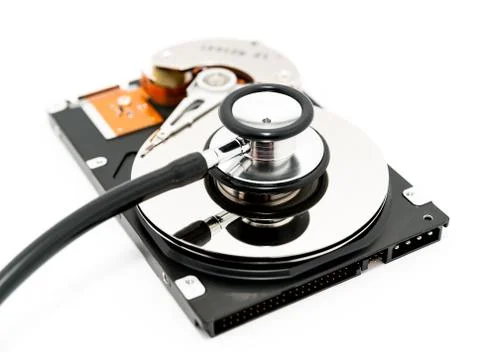 Harddisk and stethoscope Stock Photos