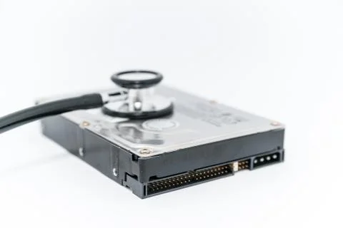 Harddisk and stethoscope Stock Photos