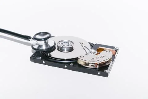 Harddisk and stethoscope Stock Photos