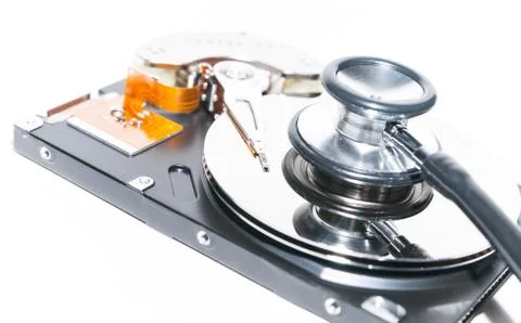 Harddisk and stethoscope Stock Photos