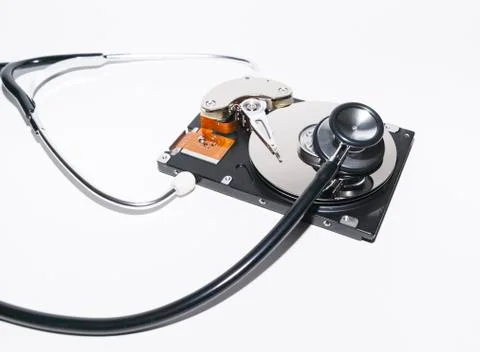 Harddisk and stethoscope Stock Photos