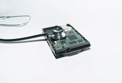 Harddisk and stethoscope Stock Photos