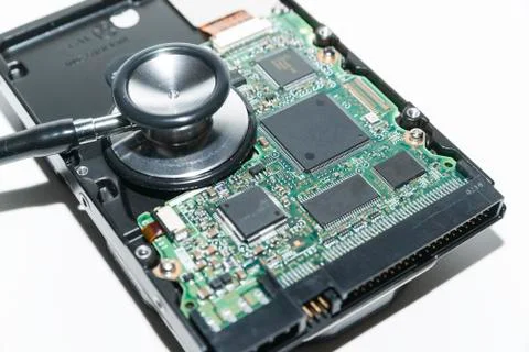 Harddisk and stethoscope Stock Photos
