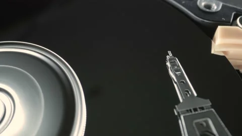 Harddisk moving head writing data on disc Stock Footage 229360021
