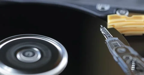 Harddisk moving head writing data on disc Stock Footage 236570170