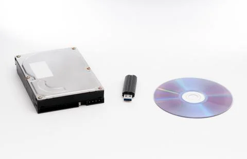 Harddrive, compact disc and USB stick on white background Stock Photos