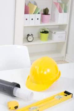 Hardhat  and measuring instruments on blueprint Stock Photos