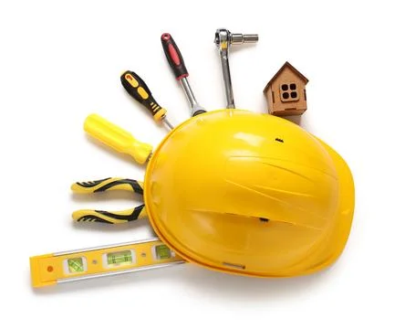 Hardhat with set of construction tools and house model isolated on white back Stock Photos
